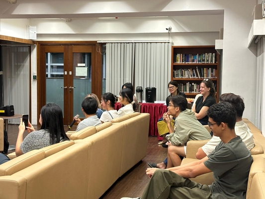 Audience members listening to the talk.
