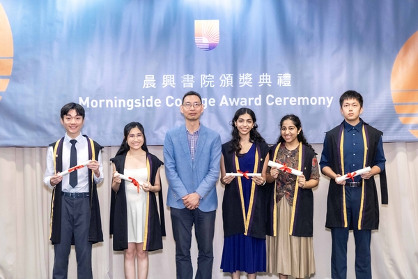 Students receiving award with Morningside College fellow.