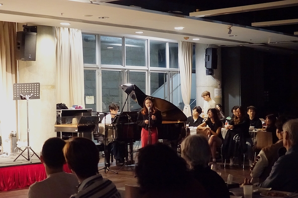 A singer and pianist perform