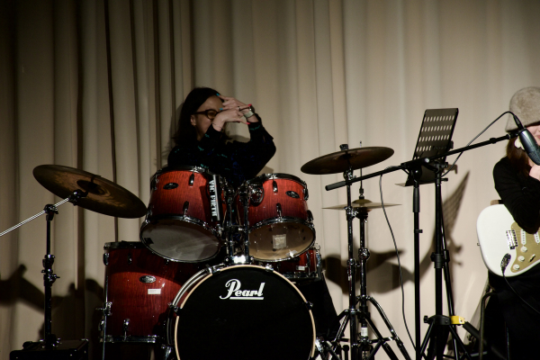MC Student Giselle behind the drums