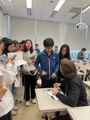 Author Nathan Thrall signs books after GEMC1001 guest lecture