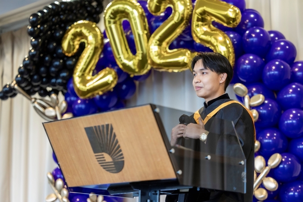 Student representative Pearl Pisutsin delivering a speech.