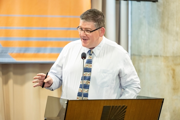 Dean of Students Professor Colin Graham delivering an address.