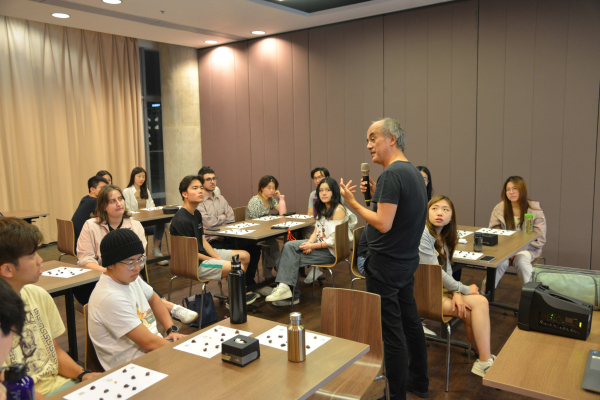 MC students listen to Charles present. 