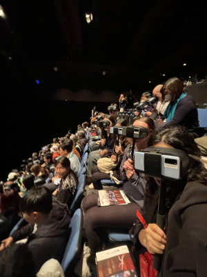MC students seated before the performance with their VR headsets on.