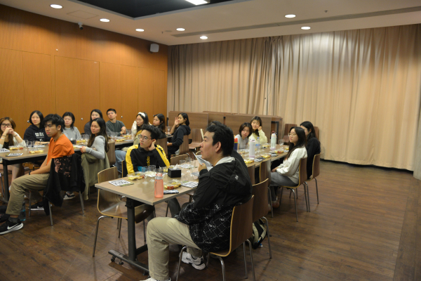 The students listening to sommelier Perry Mok.