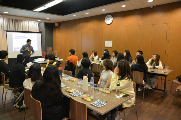 The students listening to sommelier Perry Mok.