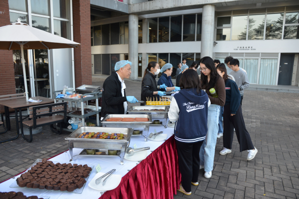 Students standing in line at the buffet.