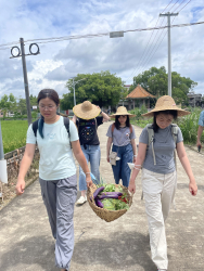 Students learning about Rock Dang's community farm