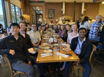 Enjoying a pizza dinner with members of the McManus Lab!