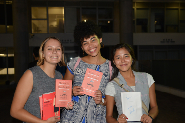 Students with their newly-signed copies of Suki Kim's books