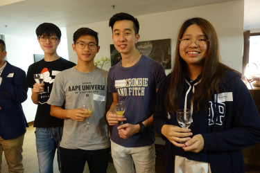 Students enjoy glasses of wine during the event