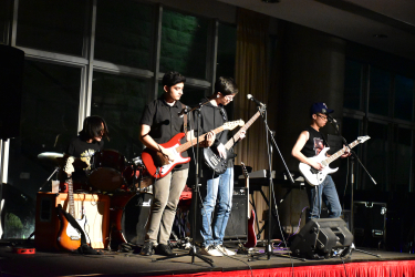 Students from Life is Improvisation and MC Band perform a few alternative rock numbers