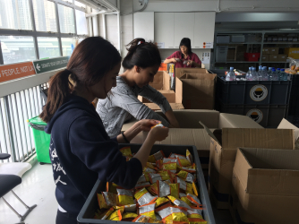 Students pack snacks at Feeding HK