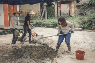 Students mixing cement