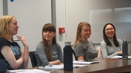 Students discuss at a lecture