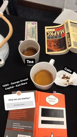 Teacups and books on table